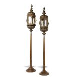 A pair of sheet copper hexagonal lanterns  Venetian, 19th century on later oak stands the lanterns