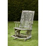 Garden Seat:An unusual hardwood rocking chair  mid 20th century