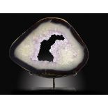 Minerals:A large Agate and Amethyst slice  Brazil on metal stand the specimen 53cm.; 21ins wide