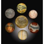 Minerals:A collection of seven mineral spheres   including Calcite, Ocean Jasper and Quartz