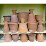 A collection of hand thrown terracotta flower pots  English, late 19th/early 20th century