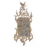 A Hand Carved Wooden French Mirror  with gilt finish 140cm.; 55ins high by 64cm.; 25ins wide by