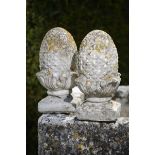 A pair of composition stone gatepier pineapple finials  2nd half 20th century 43cm.; 17ins high