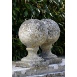 A pair of composition stone gate pier ball finials  late 19th century 43cm.; 17ins high