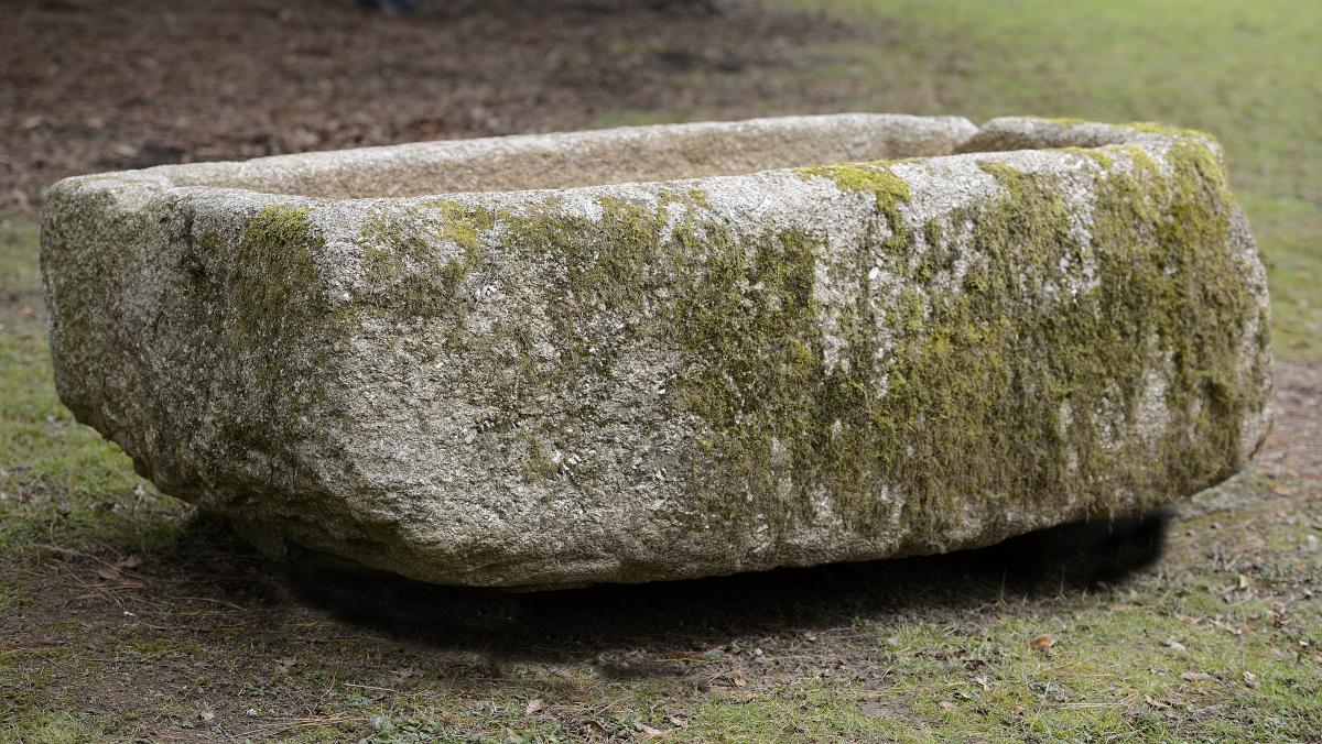 &#134A carved granite rectangular trough  55cm.; 21½ins high by 175cm.; 69ins long by 84cm.; 33ins