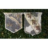 Two Victorian carved stone plaques  one dated 1857, the other with armorial leopards heads the