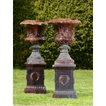 Garden Urn:A pair of glazed earthenware urns on pedestals by Preston  circa 1870