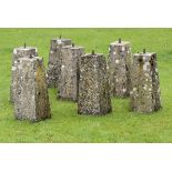 A set of seven tapering composition stone bollards  2nd half 20th century 53cm.; 21ins high