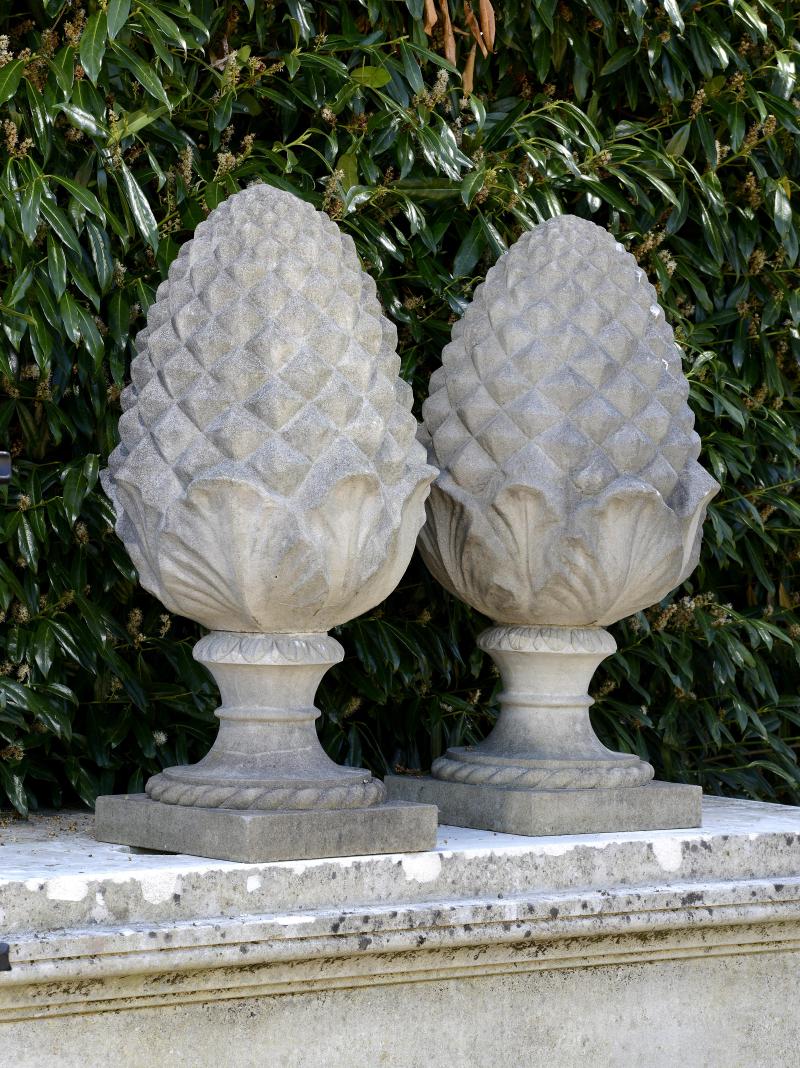 A pair of large composition stone gatepier pineapples late 20th century  91cm.; 36ins high