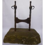 A Georgian wrought iron boot scraper  English, circa 1800 twist supports with simple foliate