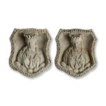 A pair of rare Austin and Seeley composition stone three quarter relief plaques  mid 19th century