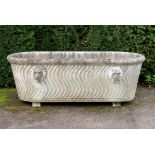 A carved white marble bath Italian, 18th century with later applied lion masks and later block