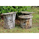 Beekeeping: A rare set of three chestnut tree trunk beehives with Lauze stone topsFrench, early 20th