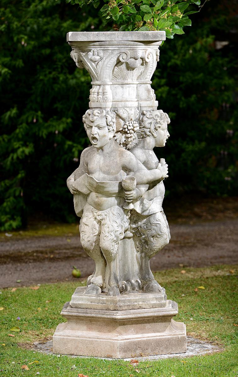 A carved white marble pedestalItalian, circa 1900carved with young Pan musicians130cm.; 51ins high