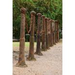 A set of ten Victorian cast iron bollards  mid 19th century together with a lengths of chain 175cm.;