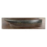 A carved wood half block model of a ship’s hull  2nd half 19th century 36cm.; 14ins high by