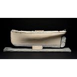 A naively carved painted pine and zinc mounted ship’s hull  1st half 20th century 28cm.; 11ins