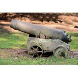 Cannon: A Georgian cast iron Carronade  late 18th/early 19th century on later 19th century wooden