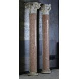 A pair of large pink granite columns  2nd half 19th century white marble Corinthian capitals and