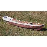 A painted hardwood canoe  2nd half 20th century 330cm.; 130ins long by 50cm.; 20ins wide by 70cm.;