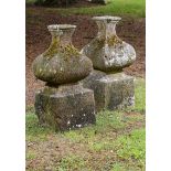 Architectural: A pair of carved sandstone gatepier bases  early 19th century 87cm.; 34ins high,