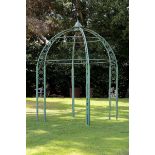 A wrought iron gazebo  1st half 20th century with later lower section 386cm.; 152ins high by 305cm.;