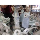 Lladro nun and lady with fan