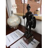 A 17 inch bronze figure of a warrior by E. Beck