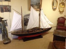 A LARGE 20TH CENTURY WOODEN SCRATCH BUILT MODEL YACHT With brass fittings, linen sails and rope