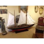 A LARGE 20TH CENTURY WOODEN SCRATCH BUILT MODEL YACHT With brass fittings, linen sails and rope