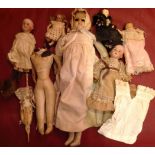 A COLLECTION OF SEVEN LATE 19TH EARLY 20TH CENTURY BISQUE HEADED DOLLS.  Condition: some AF