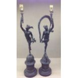 A PAIR OF LATE 19TH CENTURY BRONZE FIGURAL TABLE LAMPS Mercury and Venus, on marble bases.