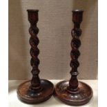 A PAIR OF 19TH CENTURY OAK CANDLESTICKS  With barley twist design. (h 30cm)