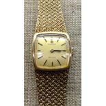 A 9CT GOLD MESH STRAP OMEGA WRISTWATCH  Having a champagne dial.