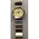 A LADIES RAYMOND WEIL BIMETALLIC WRISTWATCH  With a champagne dial.