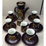 A 1970'S DENBY ARABESQUE PATTERN COFFEE SERVICE Comprising a coffee pot, a sugar and cream and six