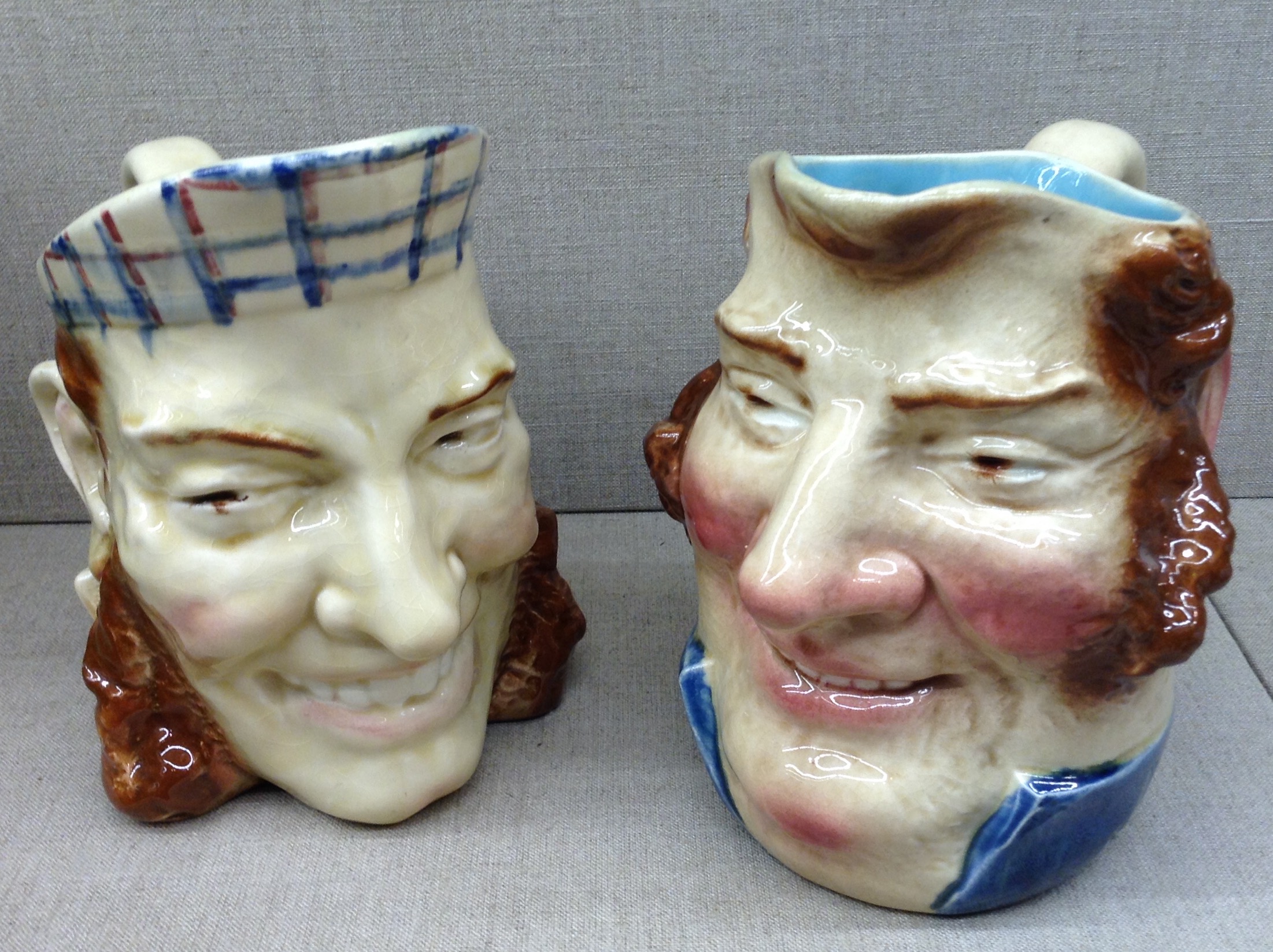 TWO SARREGUEMINES, FRANCE CHARACTER JUGS To include 'John Bull' and 'Smiling Face'