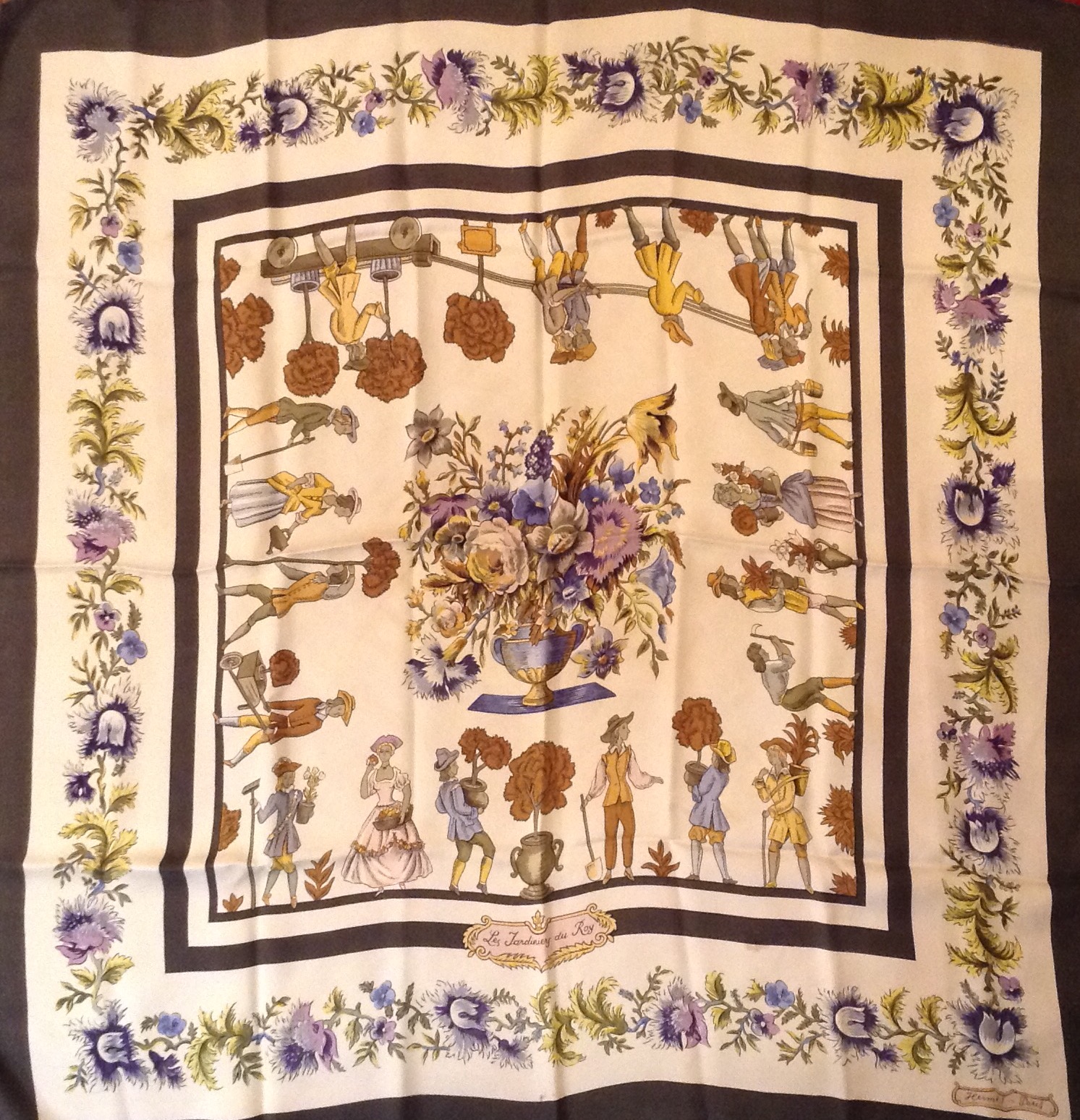 HERMÈS, PARIS A 20th Century silk 'Les Jardinières Du Roy' scarf, decorated with a central floral