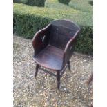 A VICTORIAN COUNTRY OAK CHILD'S CHAIR With pierced panels, raised on turned legs.