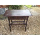 A 17TH CENTURY OAK SIDE TABLE The single drawer fitted with later handles, raised on bobbin turned