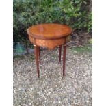 A 19TH CENTURY FRENCH PARQUETRY AND MARQUETRY INLAID CIRCULAR OCASSIONAL TABLE Raised on turned legs