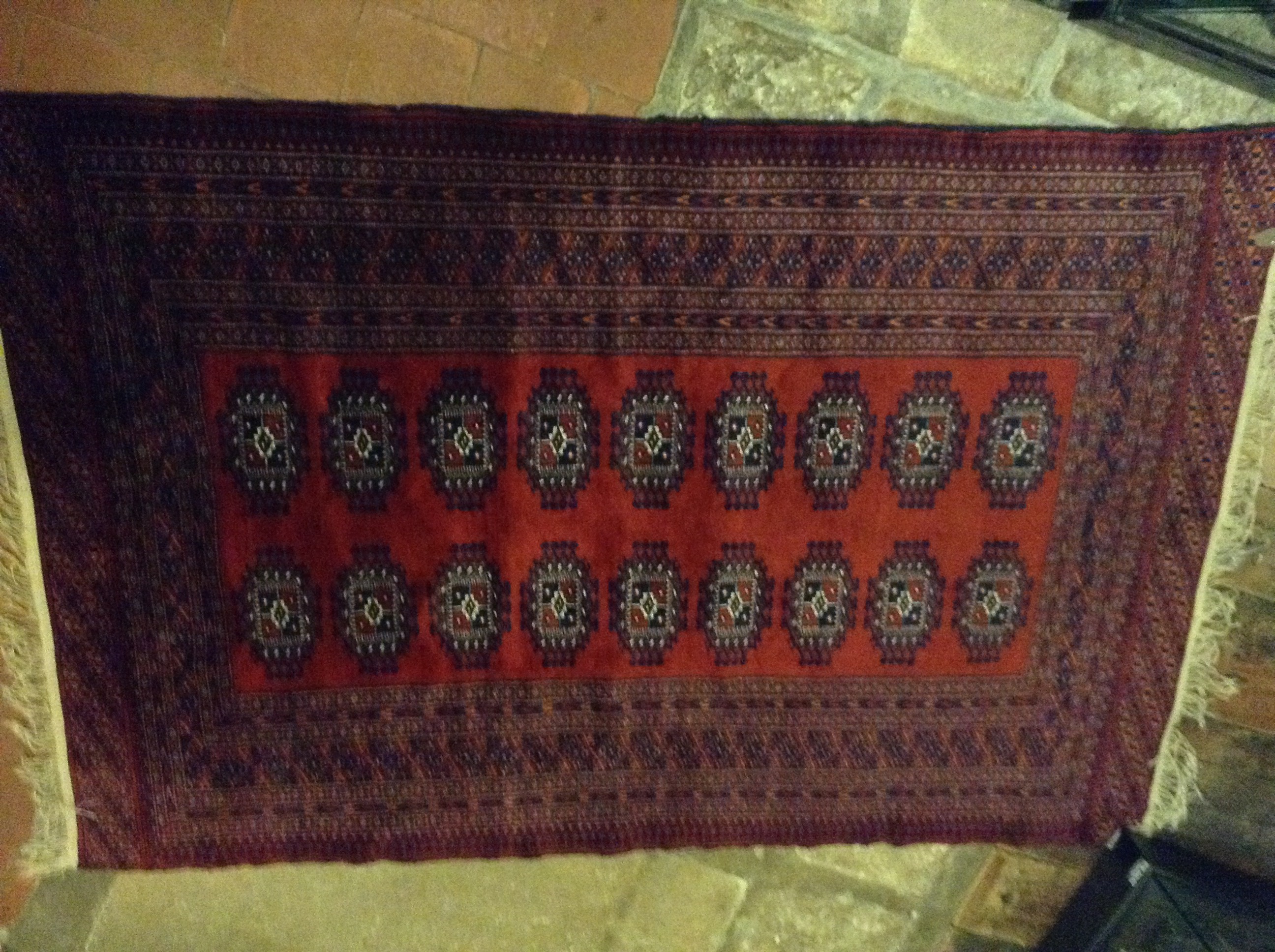 A BALUCH RUG Having a wide border and central florets. (approx 121cm x 184cm)
