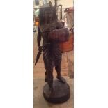 A BRONZE STATUE OF AN ANCIENT EGYPTIAN WARRIOR Supported on a circular base. (104cm)