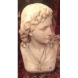 F. FISHER, S.C., A LATE 19TH/EARLY 20TH CENTURY RECONSTITUTED MARBLE BUST OF A YOUNG MAN With long