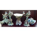 A COLLECTION FIVE 19TH CENTURY CONTINENTAL FIGURAL CENTREPIECES To include a pair of candelabras.