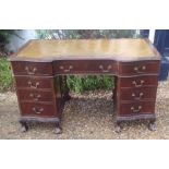 AN EARLY 20TH CENTURY MAHOGANY TWIN PEDESTAL DESK The green tooled leather writing surface, above