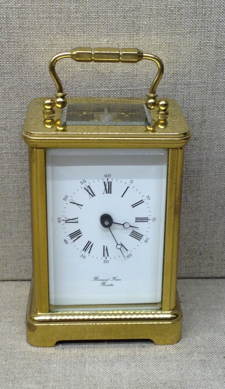 BORNAND FRÈRES, BICESTER A 20th Century brass carriage clock, with glass panels and a white dial