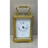 BORNAND FRÈRES, BICESTER A 20th Century brass carriage clock, with glass panels and a white dial