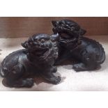 A PAIR OF 19TH CENTURY CHINESE SOLID BRONZE STATUES Of Kylins. (10cm x 8cm)