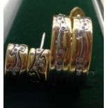 GEORG JENSEN Two pairs of bicolour yellow and white gold shaped bands, scattered with diamonds and